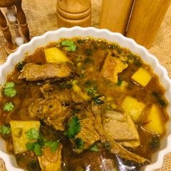 A picture of Aloo matar gosht.