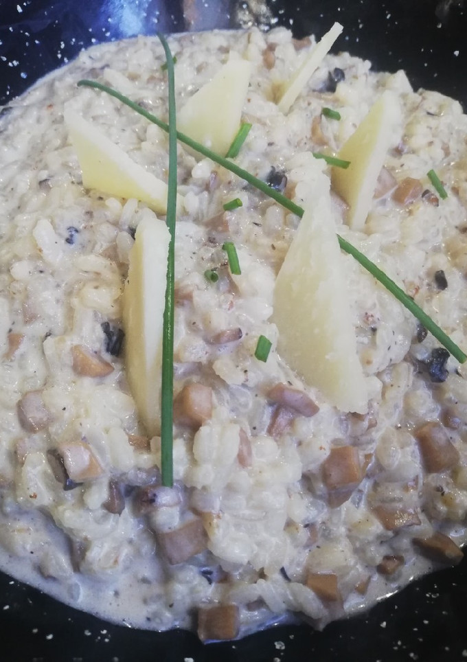 Una foto de Risotto de setas y parmesano