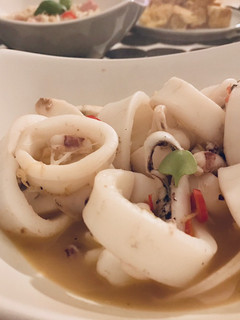A picture of Stir-fried squid with ginger, basil and chili 🦑.