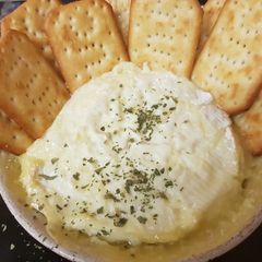 A picture of Camembert soft and smooth heated in the oven yum!!.