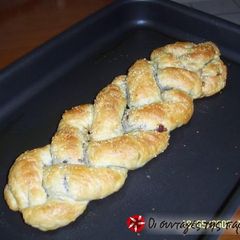 A picture of Braids with feta cheese, olives and peppers.