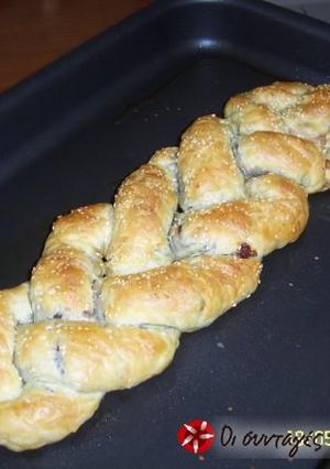 A picture of Braids with feta cheese, olives and peppers.