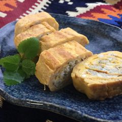 A picture of Japanese Rolled Fried Egg with baby Sardines.