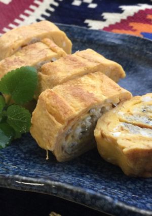 A picture of Japanese Rolled Fried Egg with baby Sardines.