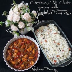 A picture of Capsicum Chilli Chicken with Vegetable Fried Rice.