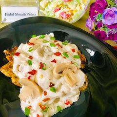 A picture of Grilled chicken with creamy mushroom sauce.