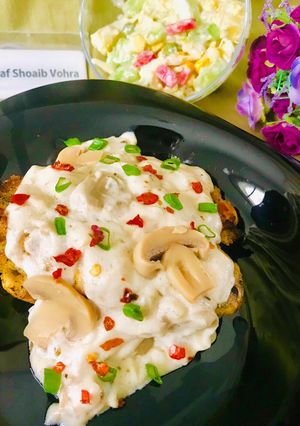A picture of Grilled chicken with creamy mushroom sauce.
