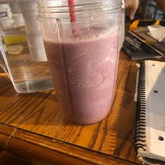 A picture of Blackberry smoothie with fresh honey.