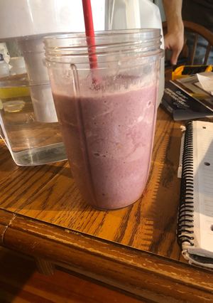 A picture of Blackberry smoothie with fresh honey.