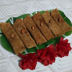 A picture of Coconut stuffed Jaggery Patishapta.