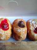 Homemade chocolate and strawberry jam doughnuts