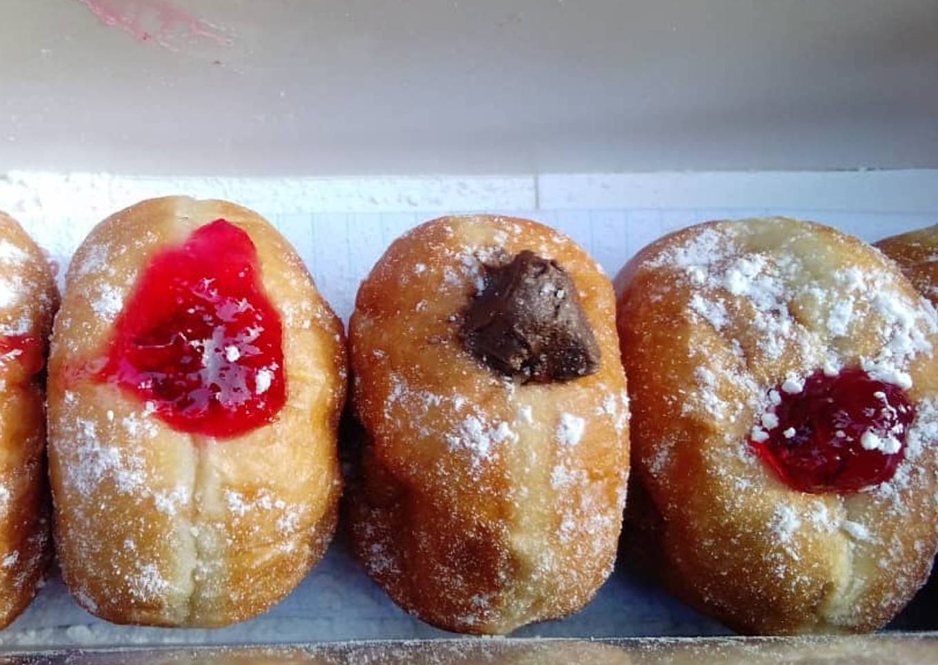 Homemade chocolate and strawberry jam doughnuts
