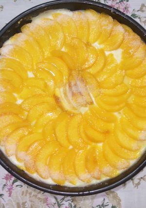 Una foto de Tarta de crema y durazno
