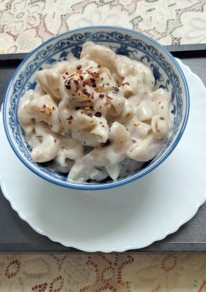 A picture of Ragi pasta in white sauce (garlic flavour).