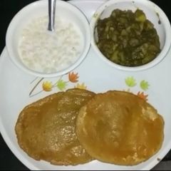 Bedmi puri with raseele aloo A picture of Bedmi puri with raseele aloo.