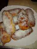 Pan  de leche relleno de crema de naranja cubierto de coco rallado
