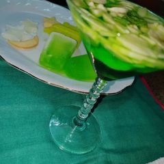A picture of Ice lollies with green cocktail.