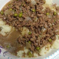 A picture of Rice Potatoes with Carne Picada cut Beef Gravy .