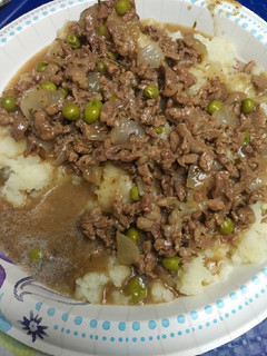 A picture of Rice Potatoes with Carne Picada cut Beef Gravy .