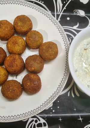 A picture of Protein Rich Cheesy Falafel with Tzatziki Dip.