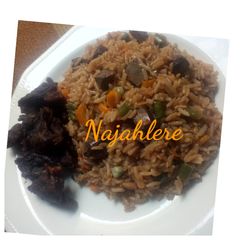 A picture of Brown fried rice with fried meat.
