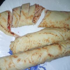 A picture of Pancakes with jam filling.