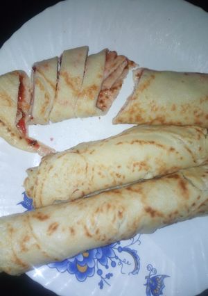 A picture of Pancakes with jam filling.