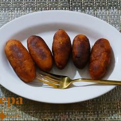 A picture of Ranga Alur Puli / Shakarkand puli/Fried Sweet Potato Dumplings.