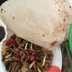 A picture of Lobia Aloo Phali with Chapati.