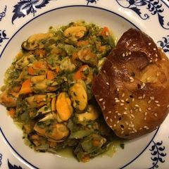 A picture of California Farm Steamed Mussels with Rouille and Rolls.