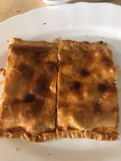 Una foto de Empanada de pollo al curry y bacon