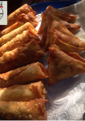 A picture of Samosa and spring rolls home made pastries.