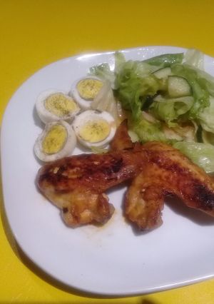 A picture of Grilled hot wings with eggs.