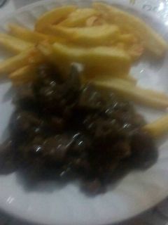 Una foto de Higado de cerdo con cebolla y pimientos