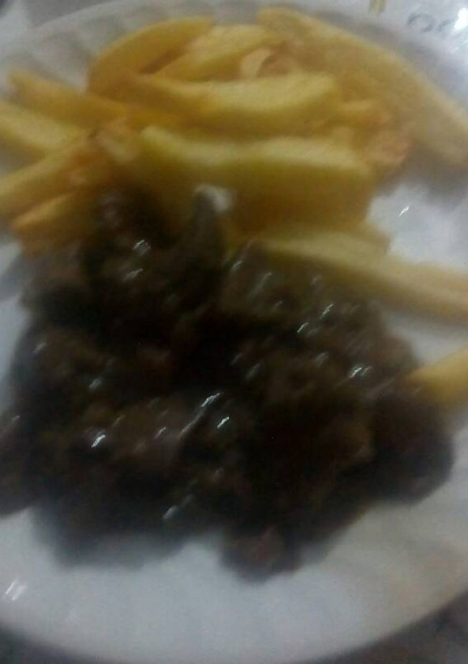 Una foto de Higado de cerdo con cebolla y pimientos