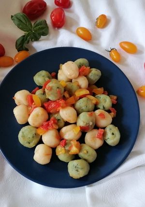 A picture of Two-Color Ricotta Gnocchi with Cherry Tomatoes.