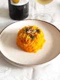 Spaghetti di carote al timo e zest di limone con pesto di basilico rucola e noci