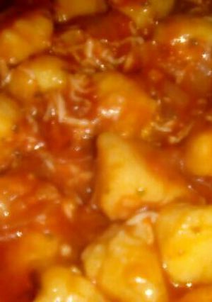 Una foto de Ñoquis de calabaza con salsa de tomate