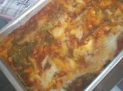 Una foto di mozzarella spinaci lasagne