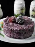 Risotto con frutti di bosco e salsiccia aromatizzato al Merlot