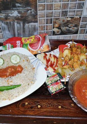 A picture of Chinese with shashlic sticks.