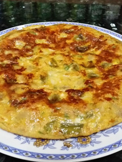 Una foto de Tortilla de champiñones y queso