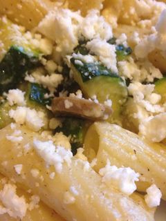 A picture of Buttered Pasta with Zucchini, mushrooms and feta cheese.