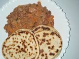Mkate wa tandoori with coconut bean stew
