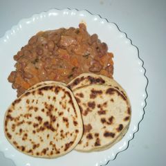 Mkate wa tandoori with coconut bean stew A picture of Mkate wa tandoori with coconut bean stew.