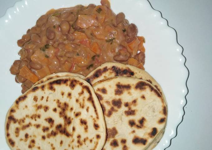 Mkate wa tandoori with coconut bean stew