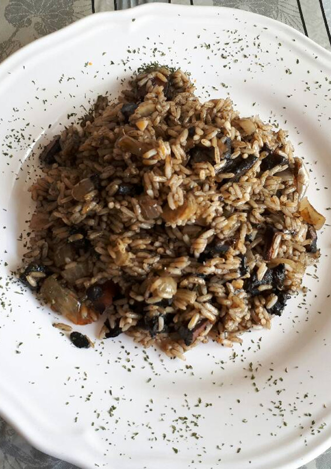 Una foto de Arroz con pota en su tinta