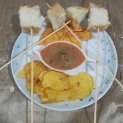 A picture of Tomatoes, burnt garlic dip.