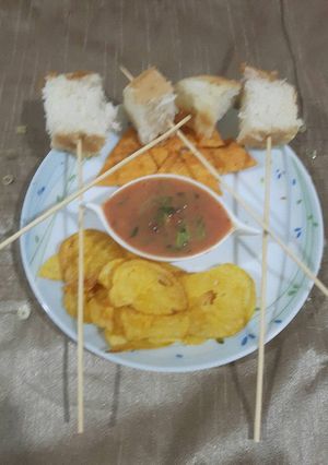A picture of Tomatoes, burnt garlic dip.