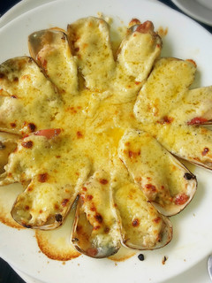 Una foto de Machas a la parmesana